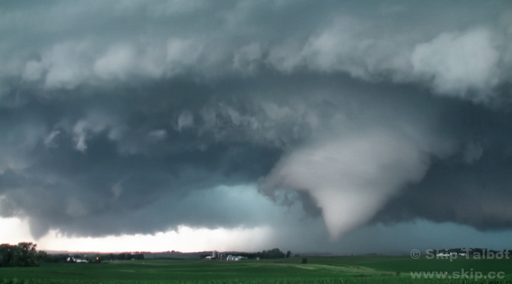 A cone shaped tornado dissipates (left) while a new one forms (right)